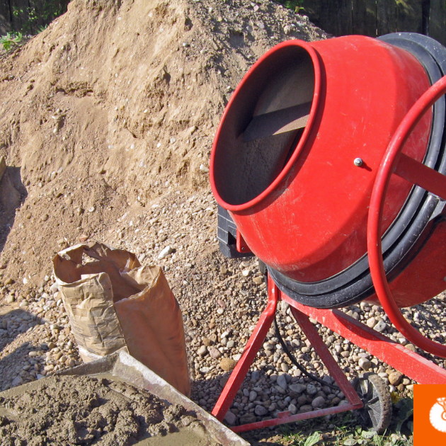 80lb concrete bag next to a cement mixer