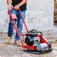 Plate compactor in use on small residential job