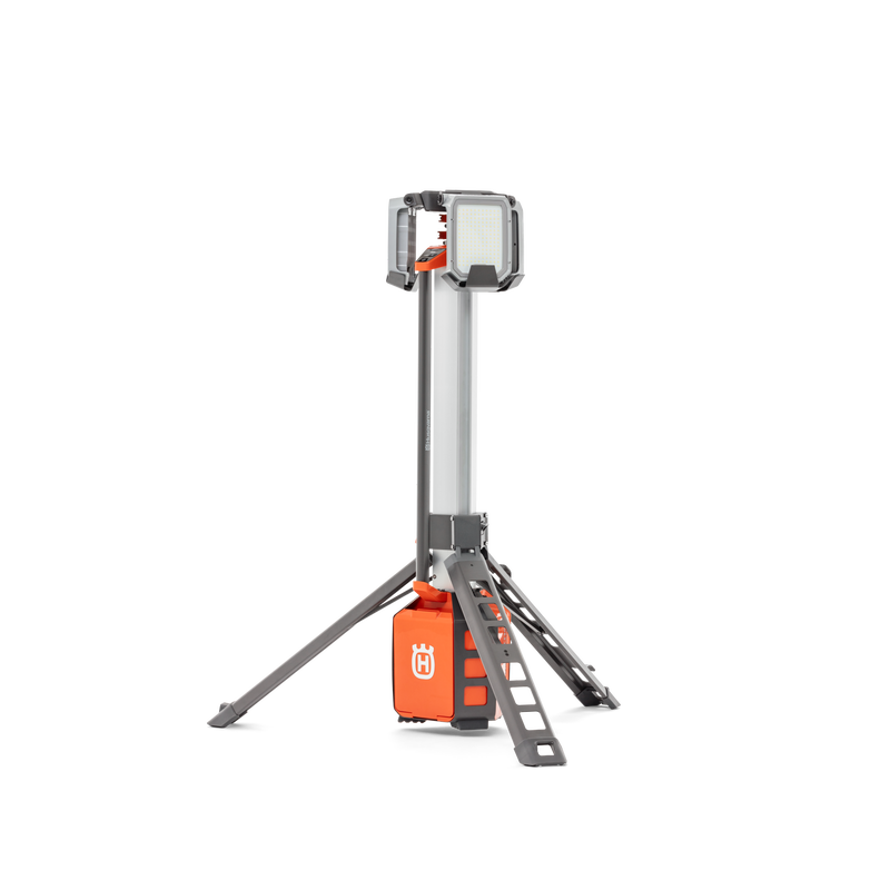 Side view of a Husqvarna construction site light on a tripod stand.