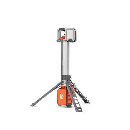 Side view of a Husqvarna construction site light on a tripod stand.