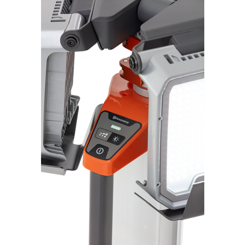 Close-up of a Husqvarna construction light with control panel and adjustable stand.